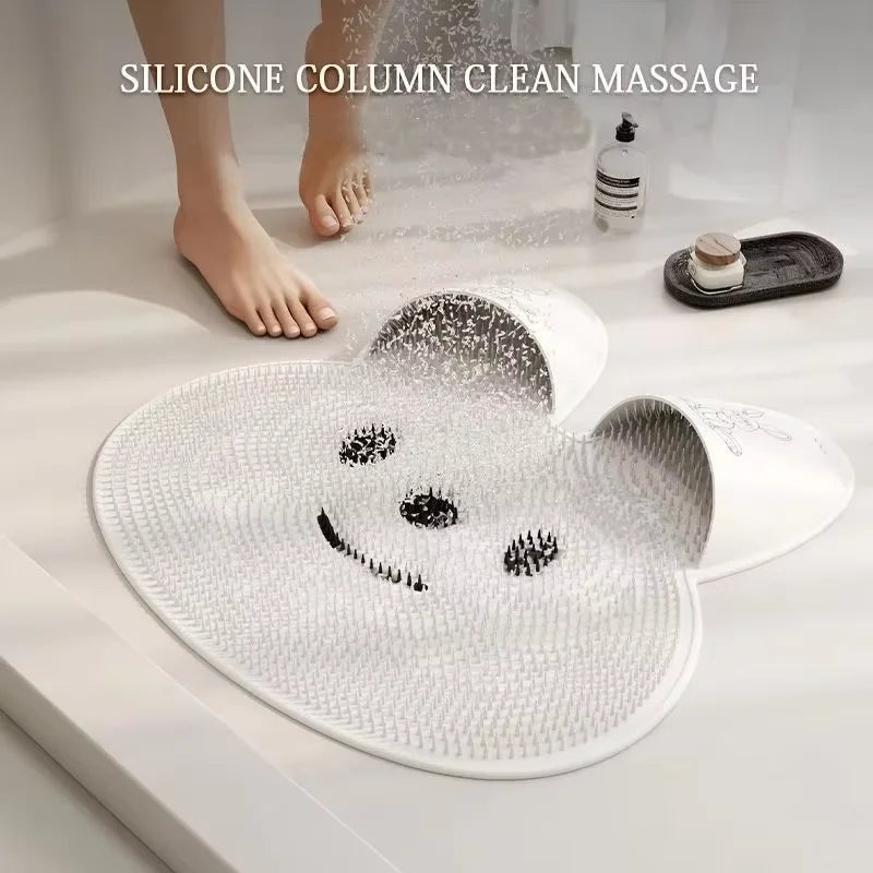 Soapy bare feet standing on the white bunny mat